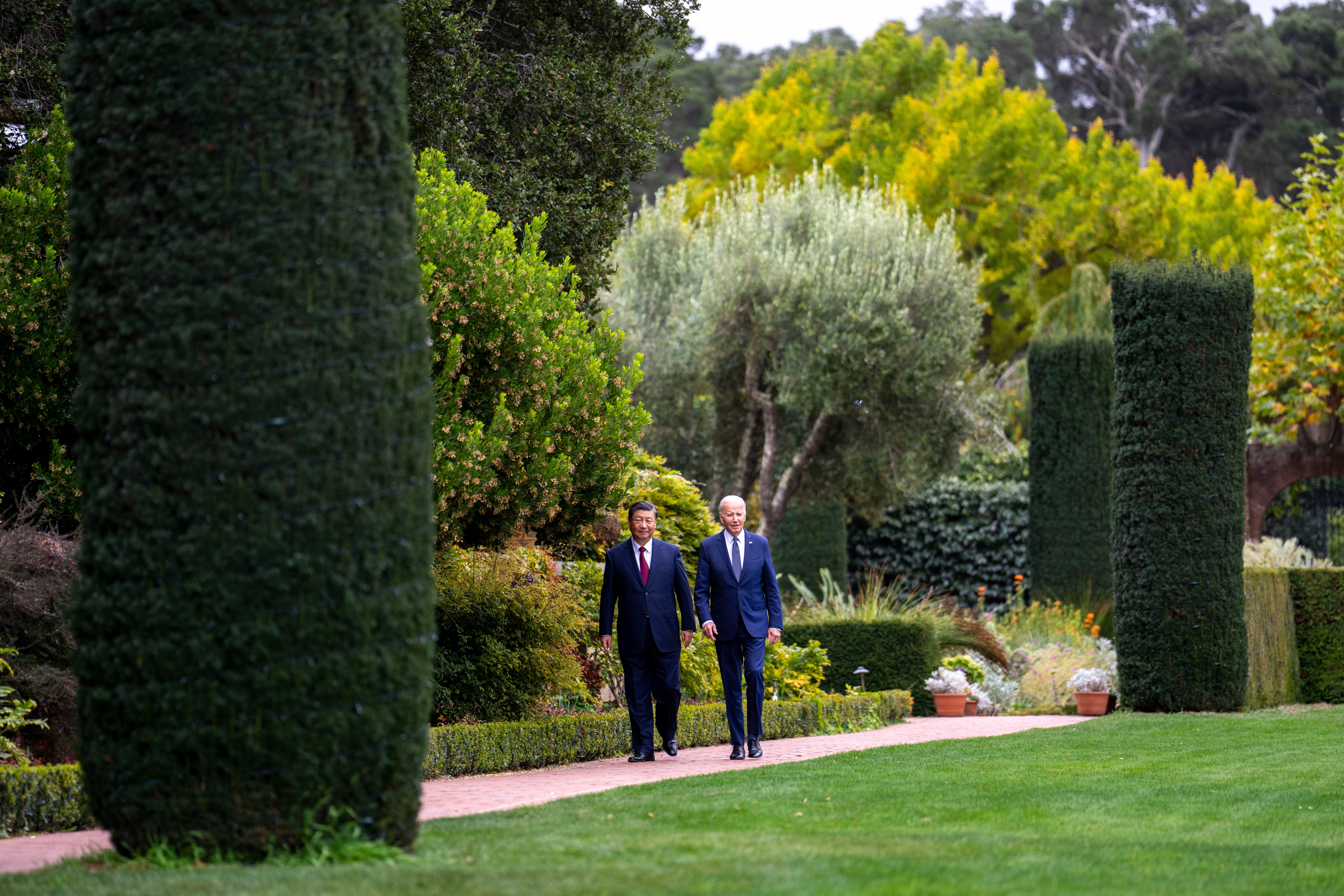 President Joe Biden and China's President Xi Jinping walk in the gardens at the Filoli Estate in Woodside, California on November 15, 2023, on the sidelines of the Asia-Pacific Economic Cooperative conference