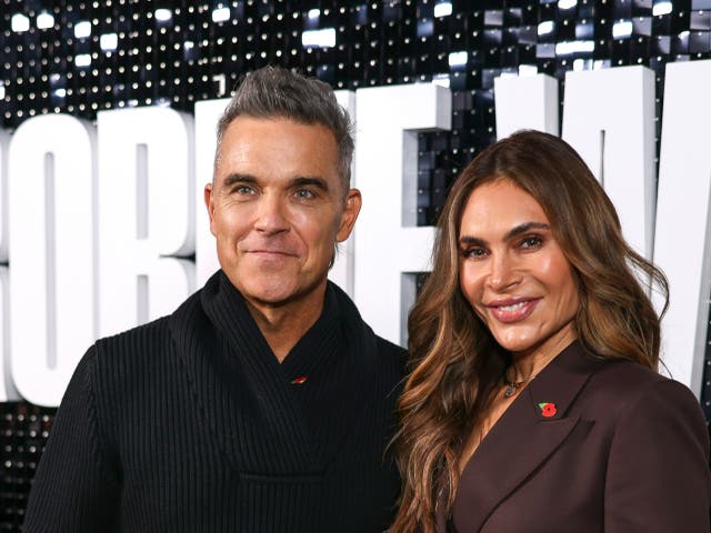 <p>Robbie Williams, left, and Ayda Field, don’t upgrade their kids on flights</p>