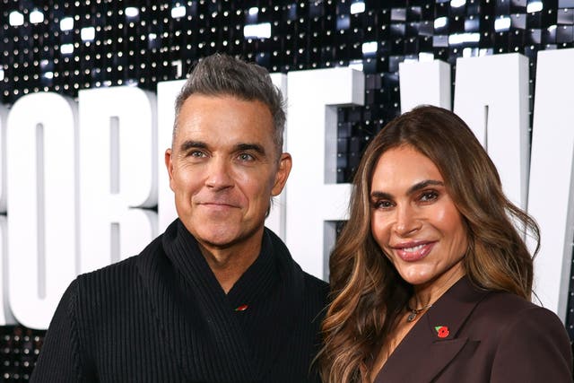 <p>Robbie Williams, left, and Ayda Field, don’t upgrade their kids on flights</p>
