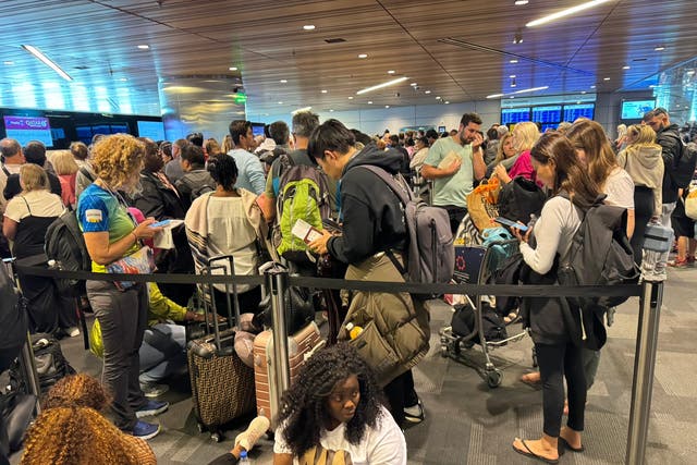 <p>Storm damage: Passengers waiting at Doha airport waiting to be rebooked</p>