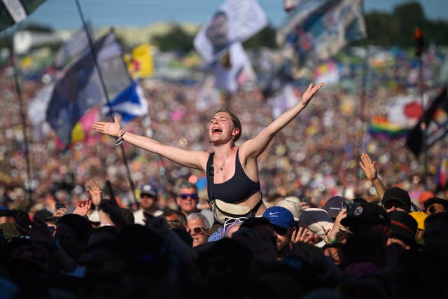 <p> People sing along as Lewis Capaldi performs on the Pyramid Stage on Day 4 of Glastonbury Festival 2023 on June 24, 2023 in Glastonbury, England.</p>