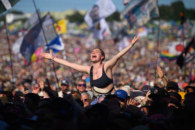 <p>People sing along as Lewis Capaldi performs on the Pyramid Stage on day four of Glastonbury 2023</p>