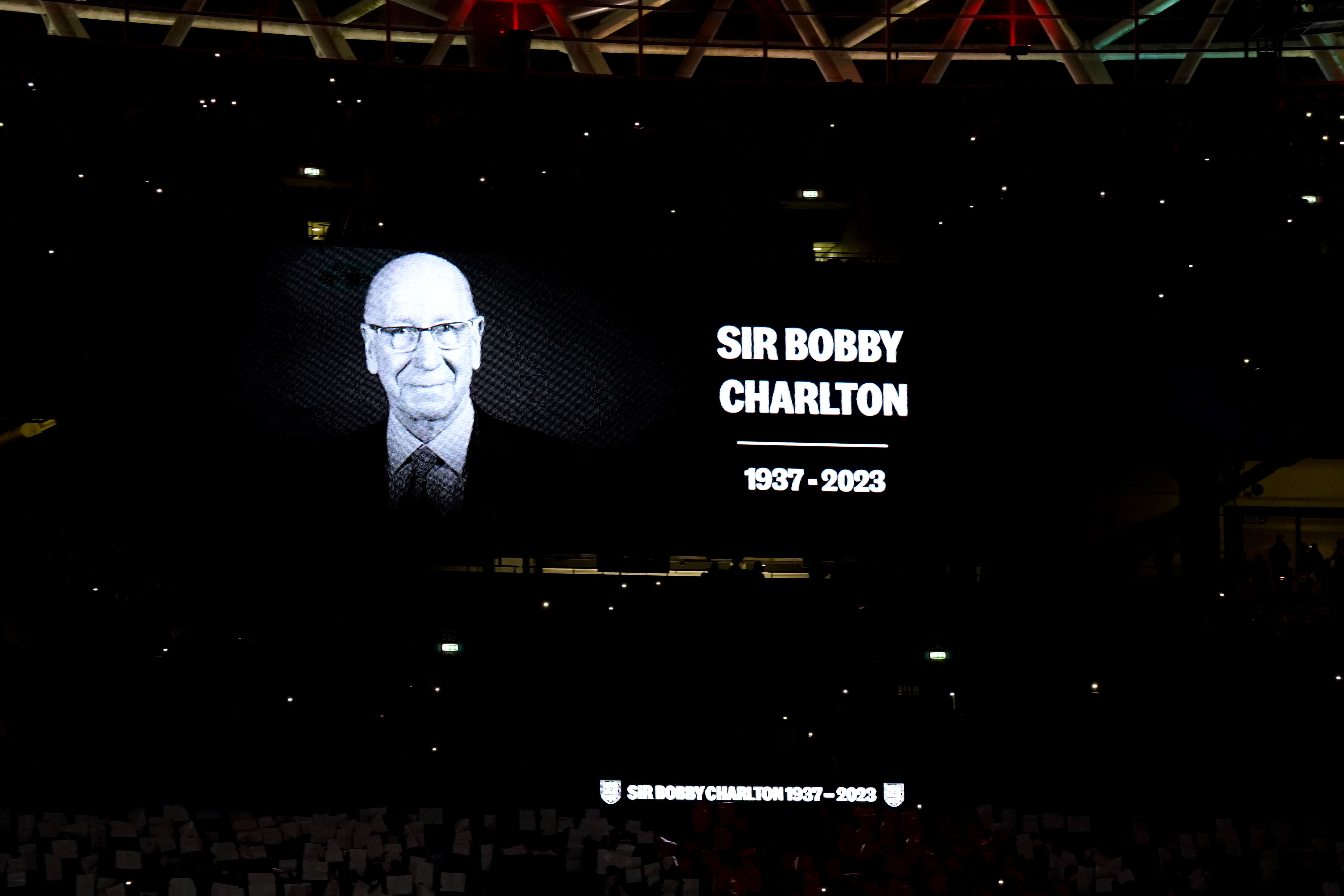 A tribute to Sir Bobby Charlton is shown on screen (Nick Potts/PA)