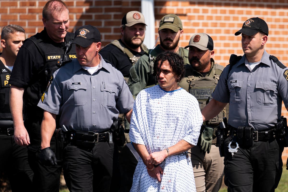 Escaped murderer back in court over crimes authorities say he committed while on the run