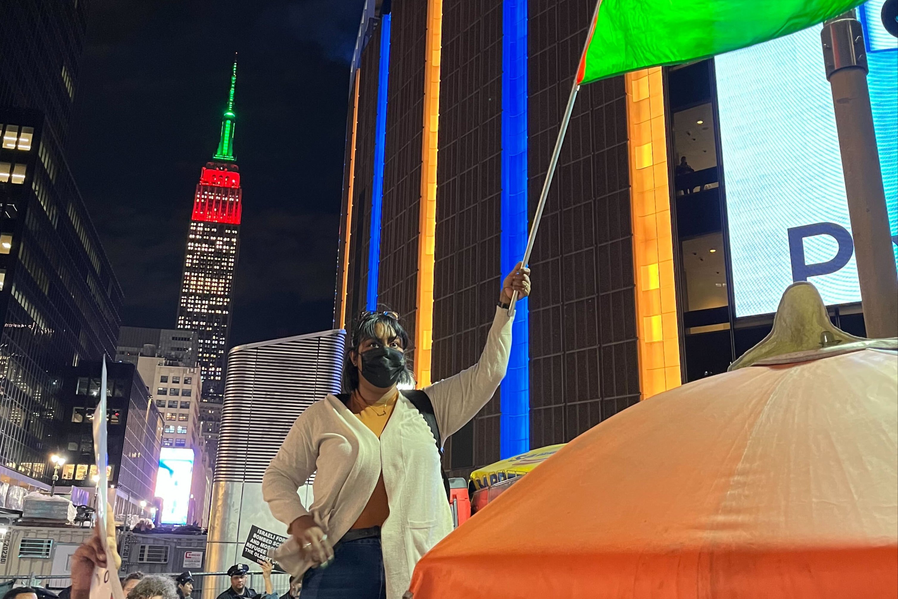 Protesters in New York City demanding a ceasefire in the Israel-Hamas war are seen in front of the Empire State Building.