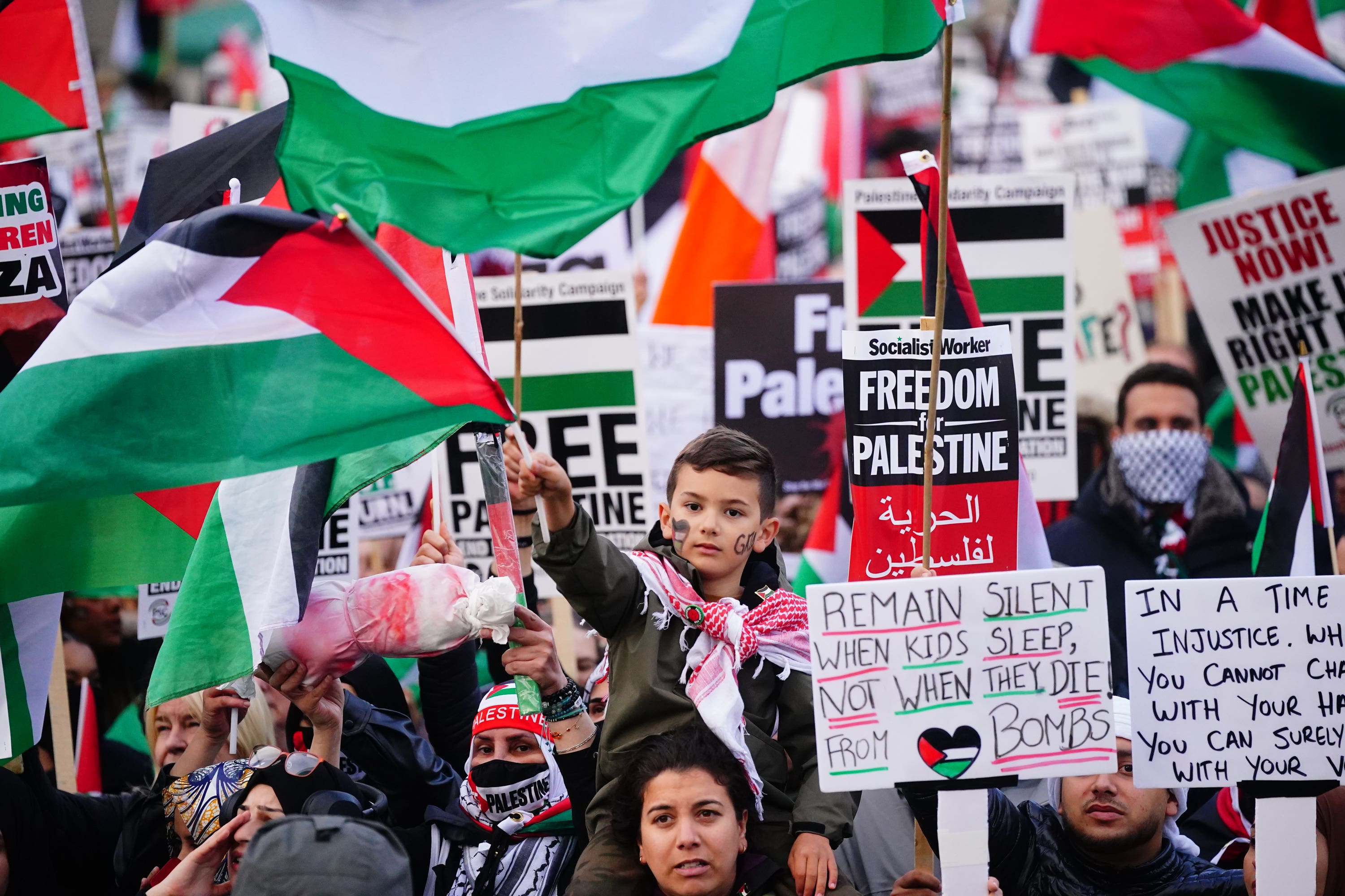 People at a rally in Trafalgar Square, London, during Stop the War coalition’s call for a Palestine ceasefire.