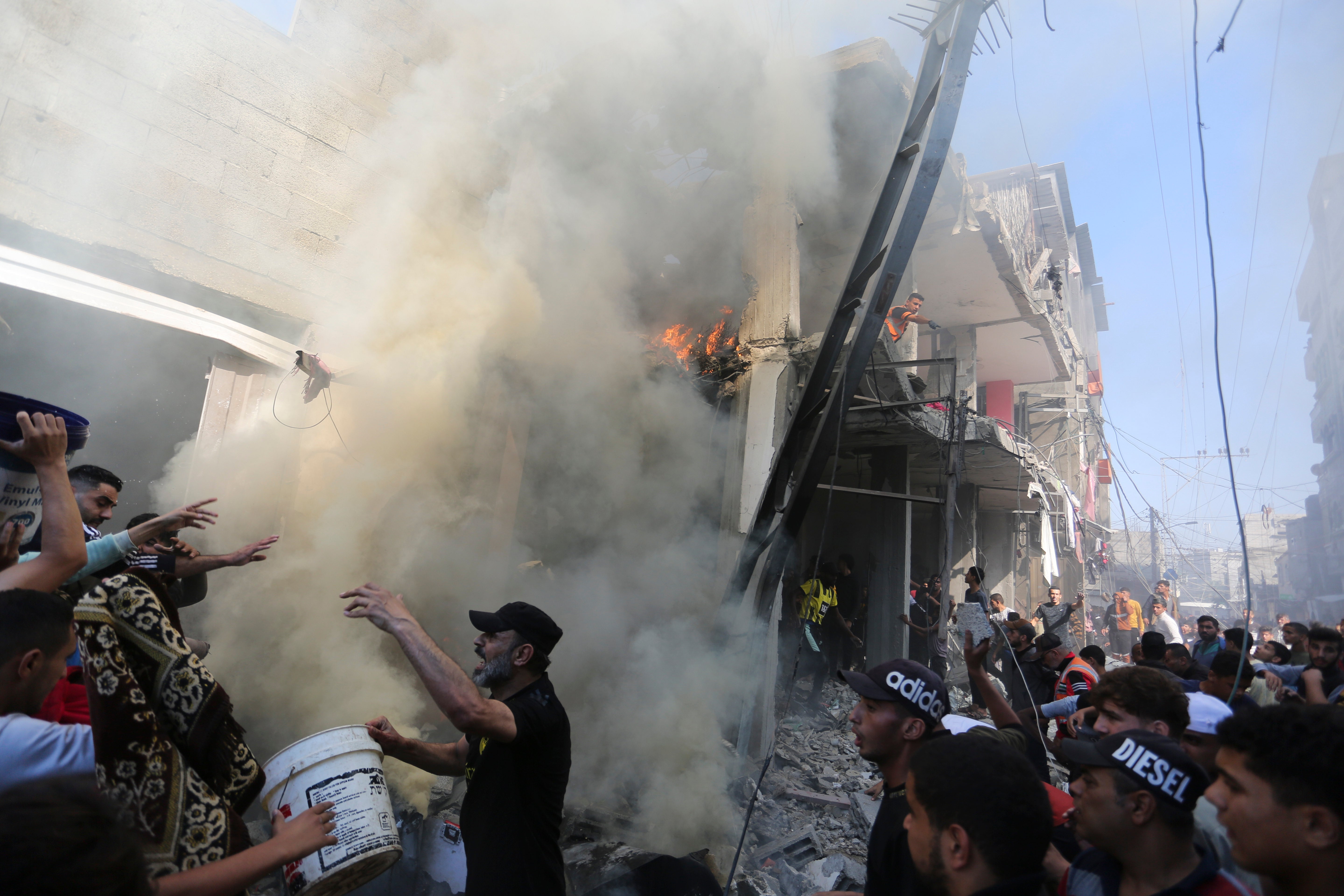 Palestinians look for survivors after an Israeli strike on Rafah, Gaza Strip, Friday, 17 Nov 2023.