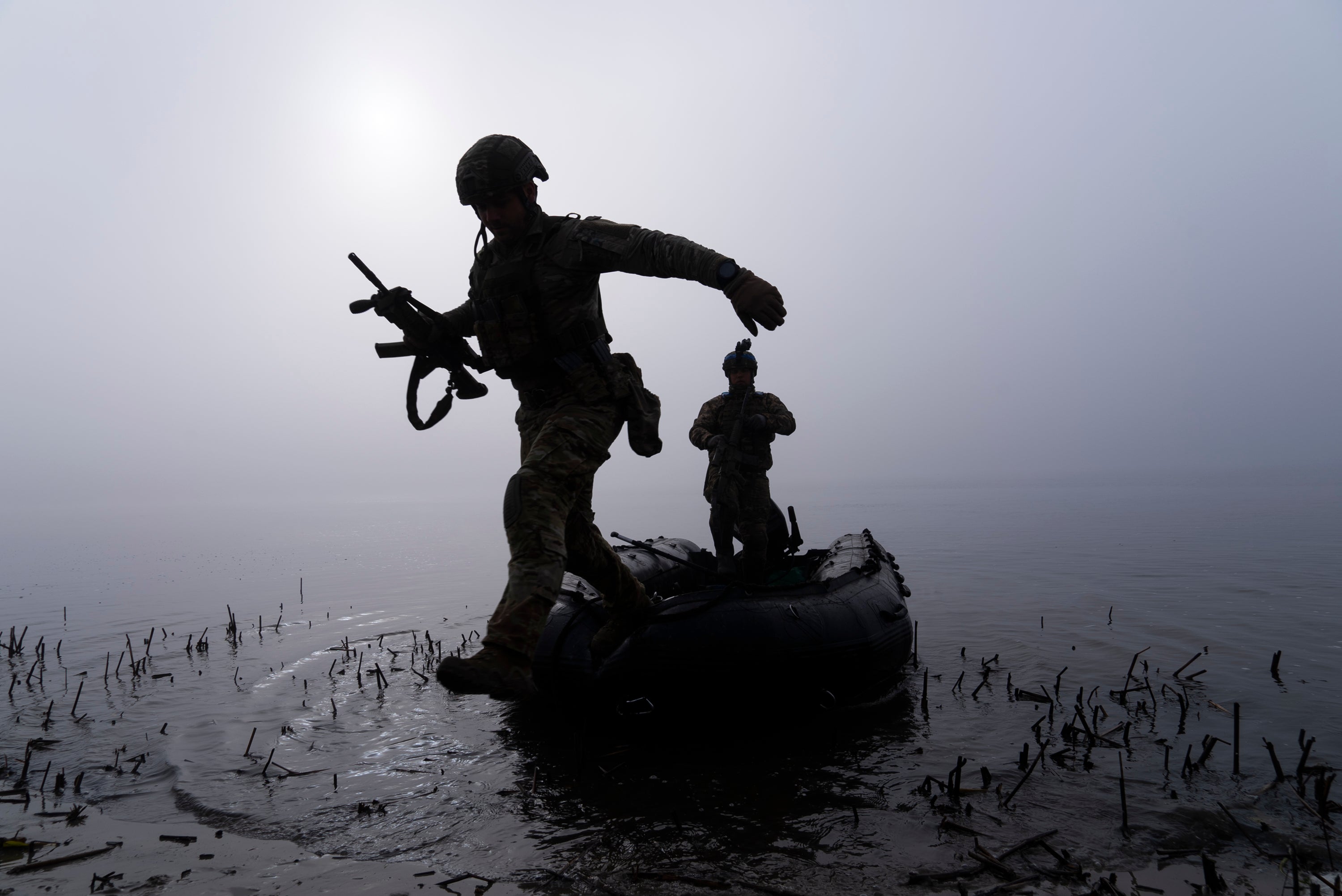 <p>A Ukrainian serviceman jumps out of the boat on the shore of Dnipro river at the frontline near Kherson, Ukraine, in October</p><p>” height=”2004″ width=”3000″ layout=”responsive” i-amphtml-layout=”responsive”><i-amphtml-sizer slot=