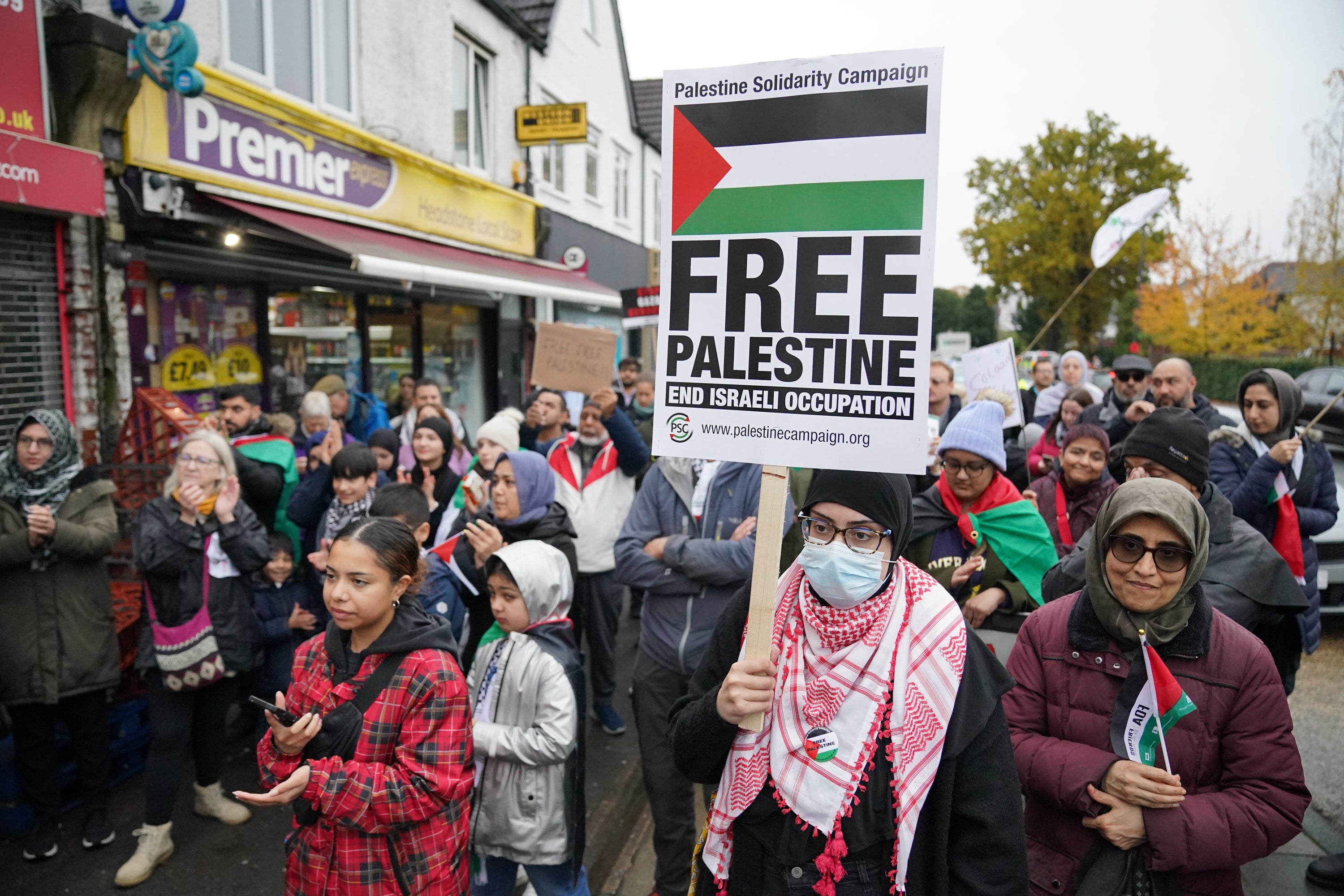 People take part in a Palestine Day of Action demonstration, outside the office of Harrow East MP Bob Blackman