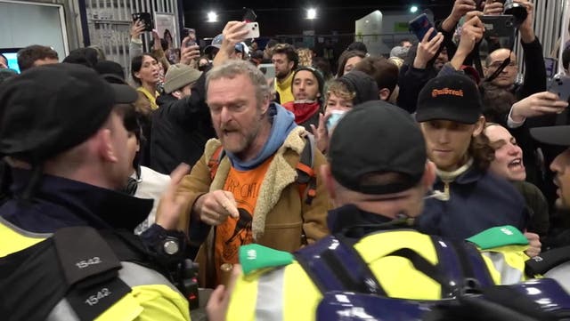 <p>Police officers surround Pro Palestine protesters at Waterloo Station.</p>