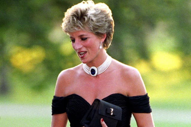 Diana, Princess of Wales wearing a black pleated chiffon dress, with floating side panel, by Christina Stamboulian, during a party given at the Serpentine Gallery in London (Martin Keene/PA)