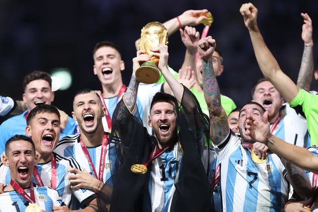 <p>Lionel Messi lifts the Fifa World Cup trophy after Argentina’s penalty shootout win over France at Lusail Stadium on 18 December 2022 in Lusail City, Qatar</p>