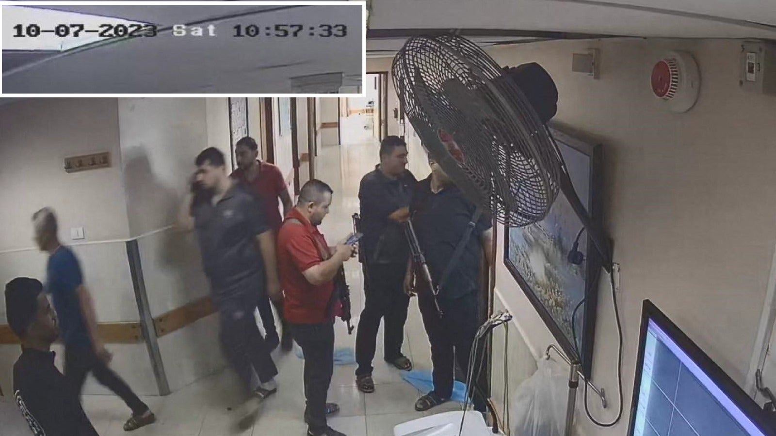 CCTV footage of what the IDF says were Hamas fighters bringing hostages into the hospital