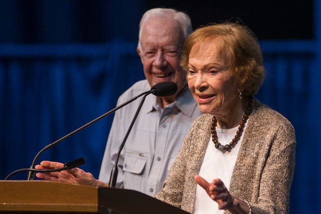 <p>Former first lady Rosalynn Carter speaks next to her husband, former President Jimmy Carter, during the opening ceremony for the Jimmy & Rosalynn Carter Work Project, Aug. 26, 2018, inside the University of Notre Dame's Purcell Pavilion in South Bend, Ind. </p>