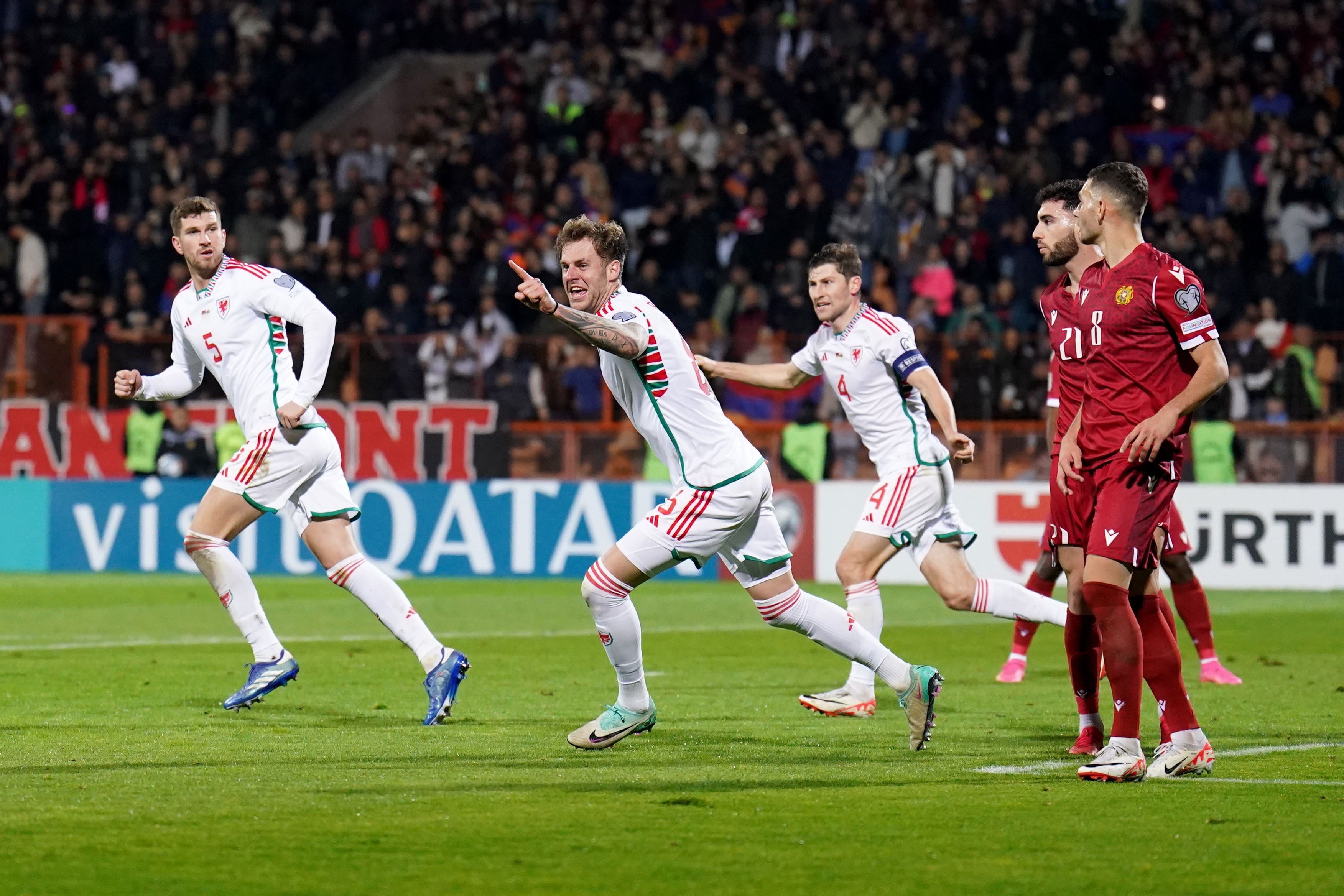 Joe Rodon celebrates Wales’ equaliser during their 1-1 draw against Armenia on Saturday (Zac Goodwin/PA)