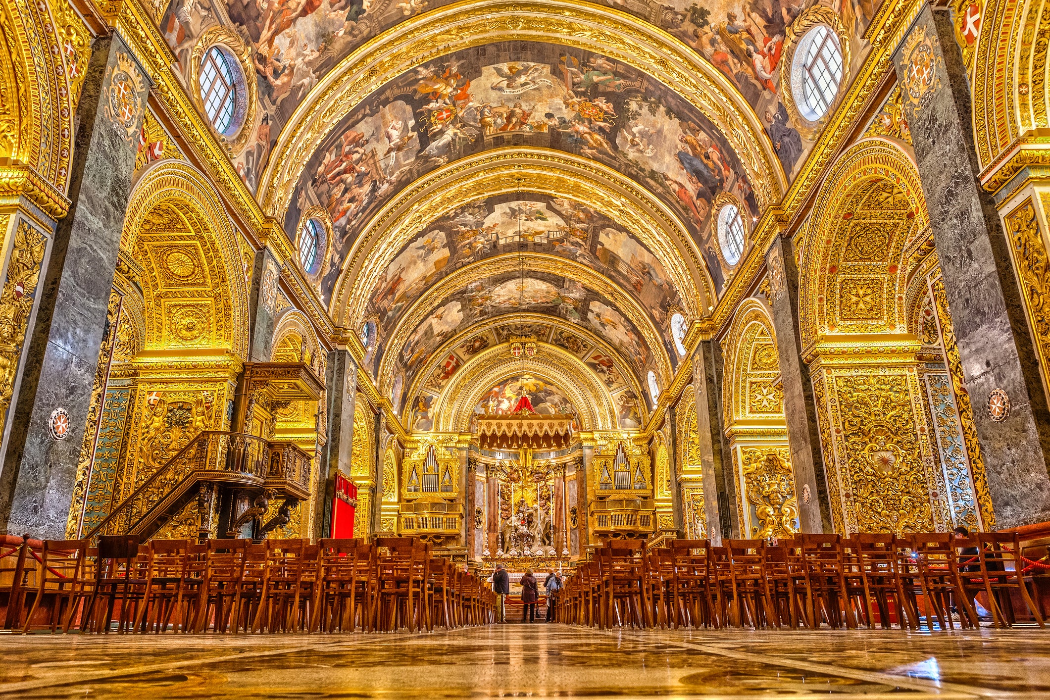 The Baroque building is laden with tapestries, chapels and a series of tombs accented with gold