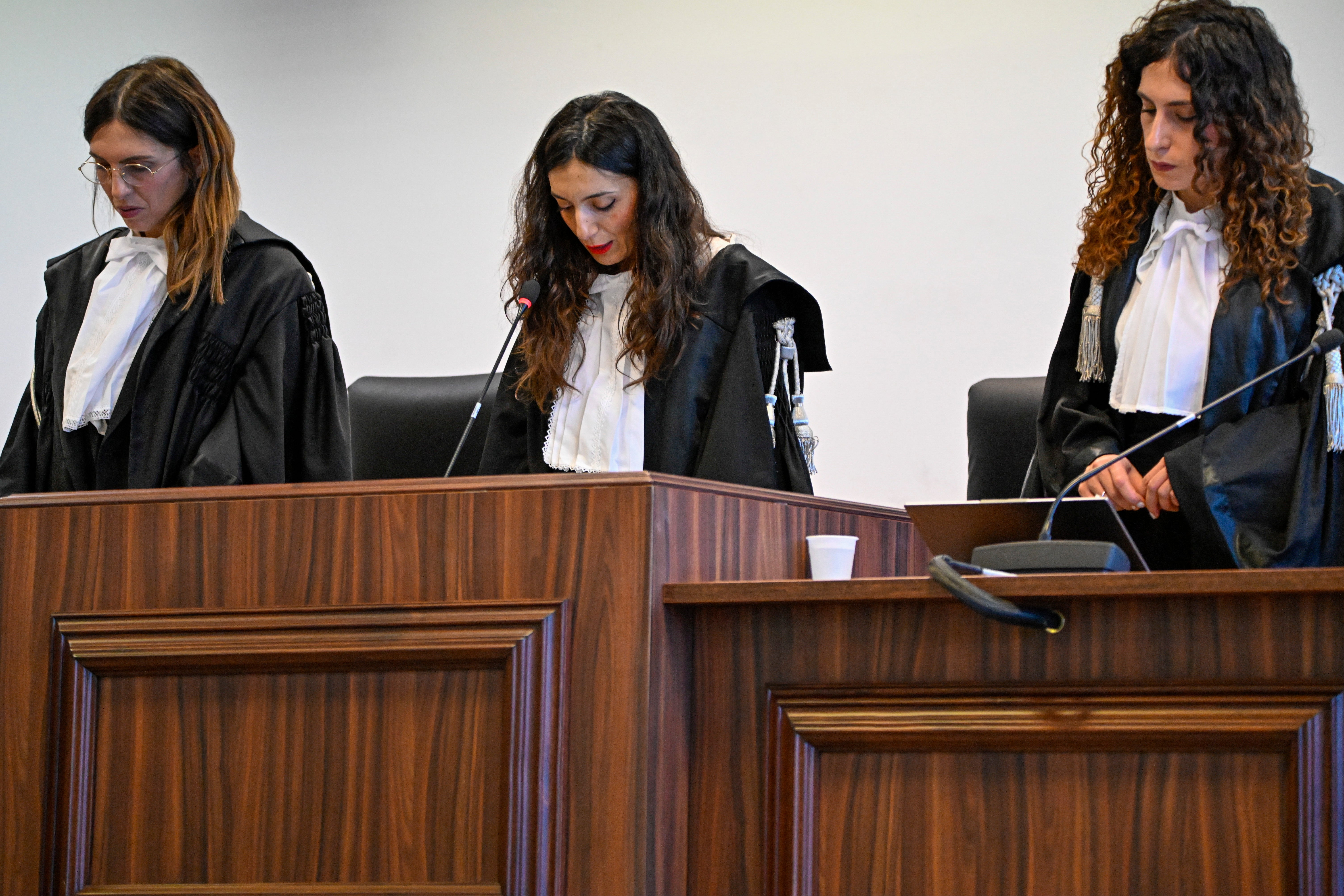 President of the court, Judge Brigida Cavasino, centre, flanked by judges Claudia Caputo, left, and Germana Radice