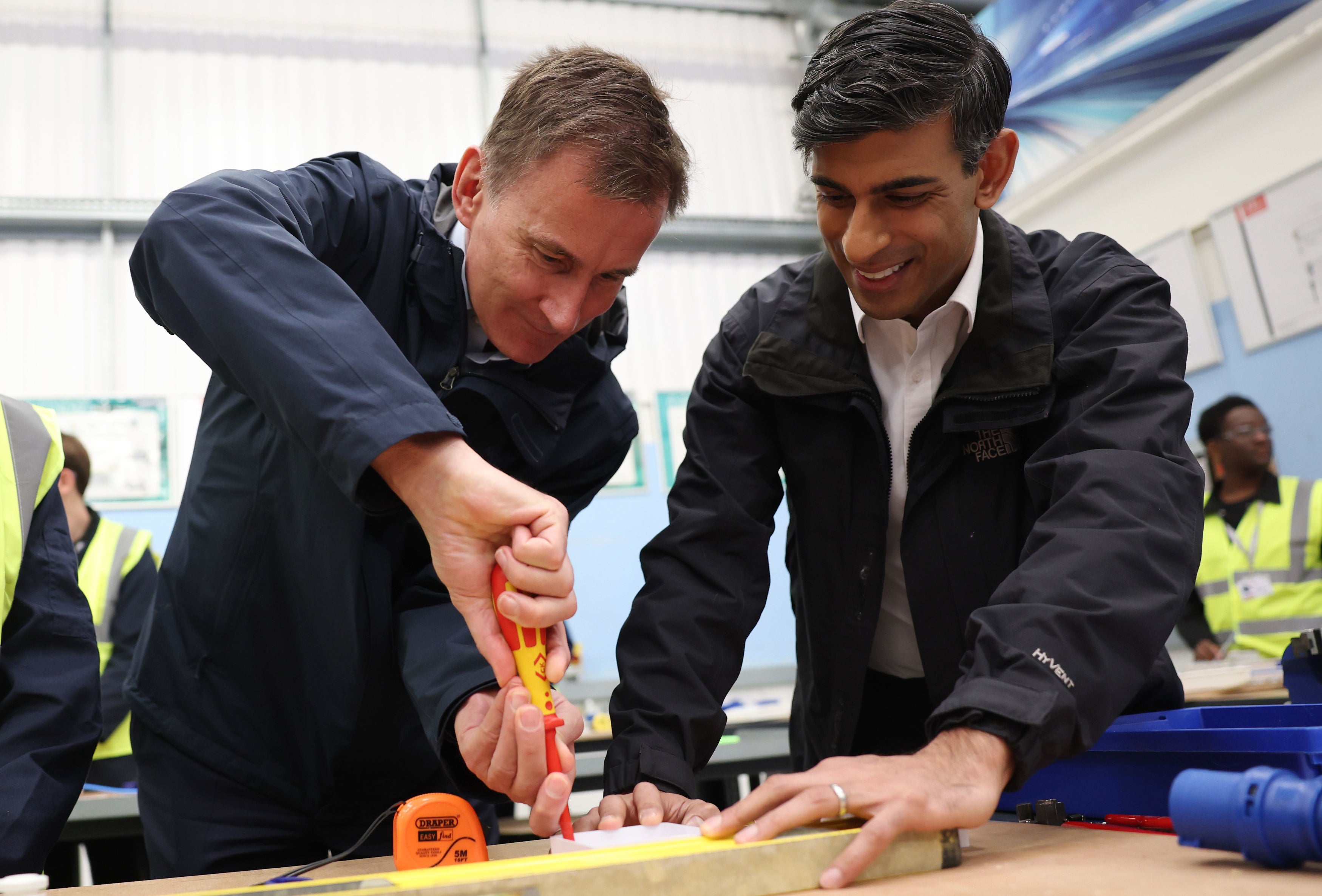 Turning the screw: Rishi Sunak and Jeremy Hunt visit a training centre in London on Monday