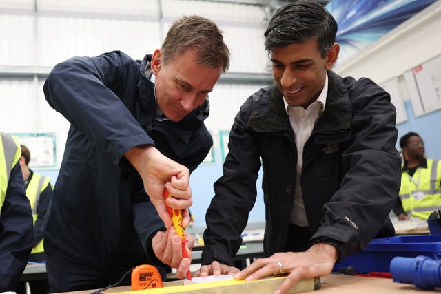 <p>Turning the screw: Rishi Sunak and Jeremy Hunt visit a training centre in London on Monday</p>