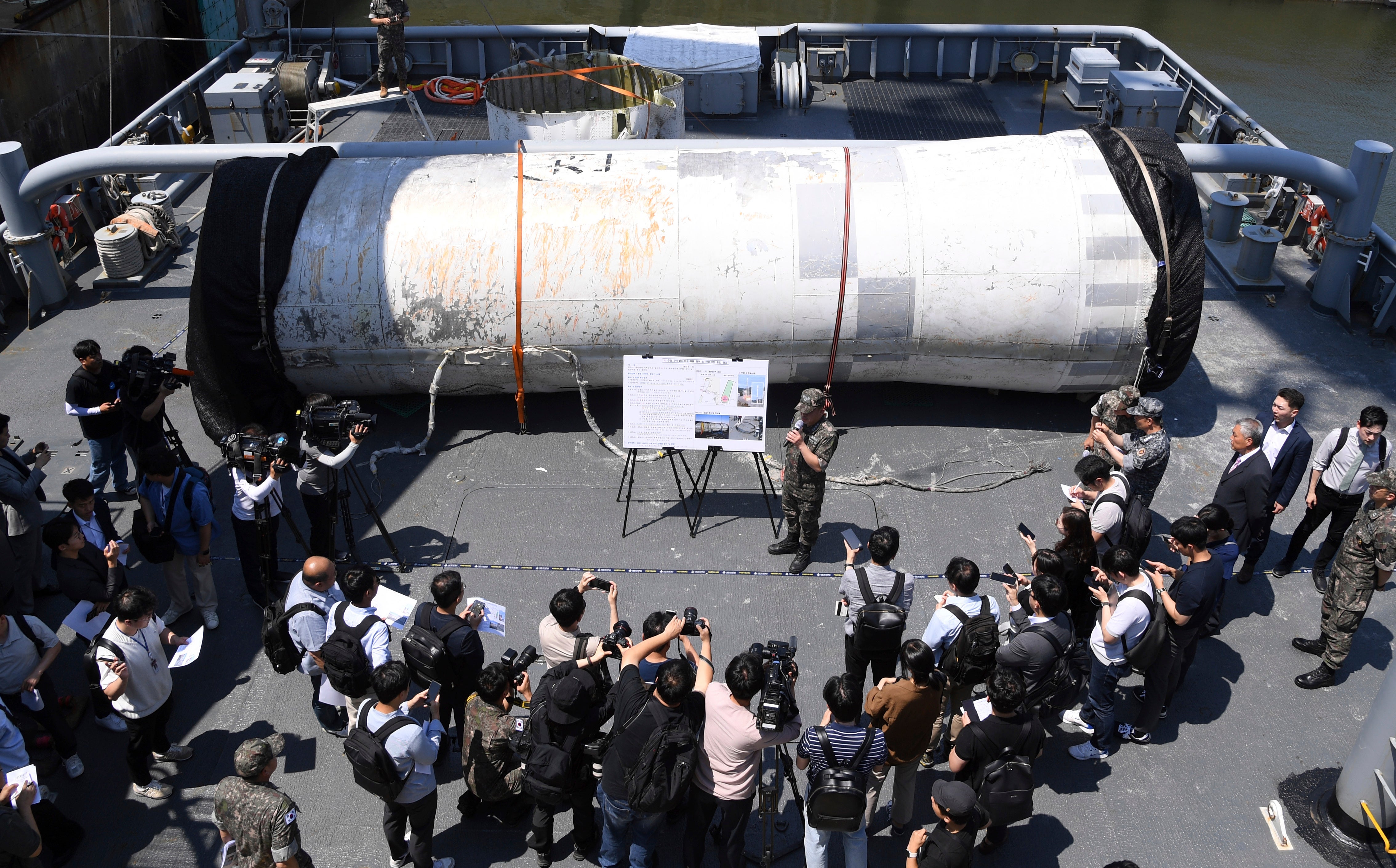 Objects salvaged by South Korea's military that are presumed to be parts of the North Korean space-launch vehicle that crashed into sea following a launch failure, are displayed