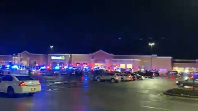 <p>A still from the outside the Walmart store in Ohio shows police vehicles arriving at the scene on Monday </p>