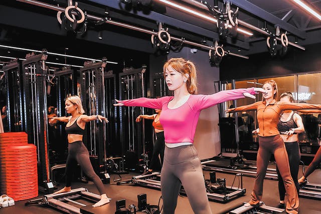 <p>Members take a Pilates class at a Pure yoga studio at Jing’an Kerry Centre in Shanghai in October 2023</p>