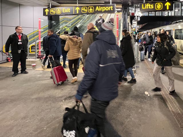 <p>Maiden journey: Passengers emerging from the first train to use the new facilities at Gatwick airport </p>