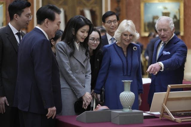 The King and Queen shows the President of South Korea Yoon Suk Yeol and his wife Kim Keon Hee a special exhibition of items in the Picture Gallery at Buckingham Palace (Kin Cheung/PA)