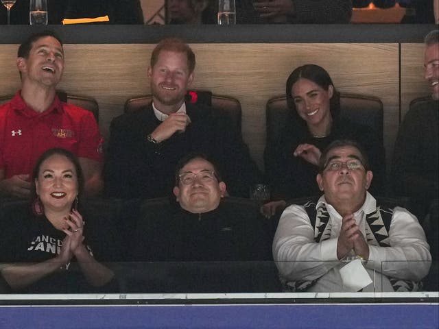<p>Prince Harry, top second from left, and Meghan Markle, top right, The Duke and Duchess of Sussex, watch the Vancouver Canucks and San Jose Sharks play during the first period of an NHL hockey game in Vancouver, British Columbia, on Monday, Nov. 20, 2023.</p>