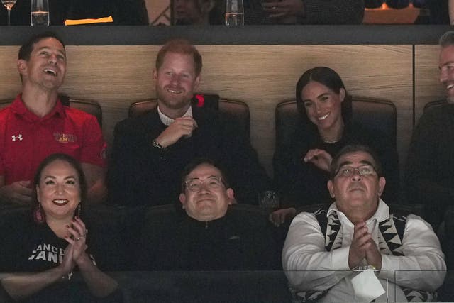<p>Prince Harry, top second from left, and Meghan Markle, top right, The Duke and Duchess of Sussex, watch the Vancouver Canucks and San Jose Sharks play during the first period of an NHL hockey game in Vancouver, British Columbia, on Monday, Nov. 20, 2023.</p>