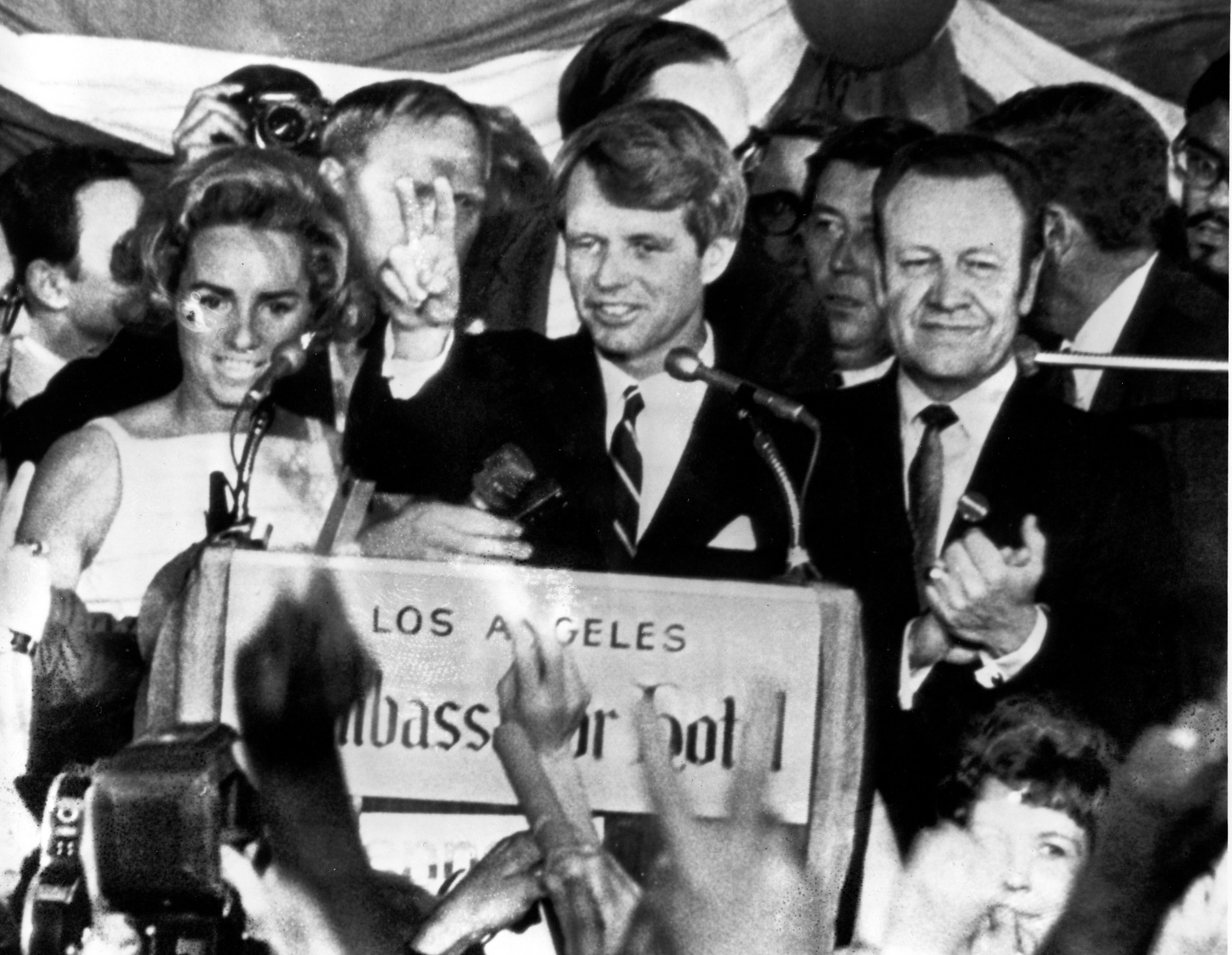 Ethel Kennedy stands next to her husband Senator Robert F Kennedy (center) as he speaks to campaign workers at the Ambassador Hotel in Los Angeles on June 5 1968. Minutes later, RFK was shot dead