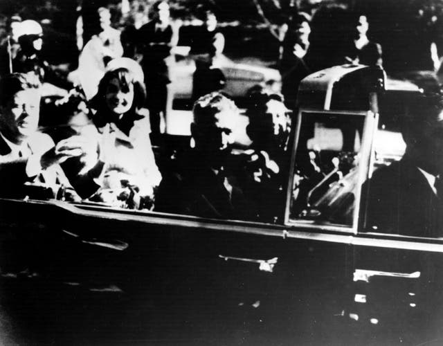 <p>President John F Kennedy and first lady Jacqueline Kennedy in an open car motorcade shortly before the president was assassinated in Dallas, Texas</p>