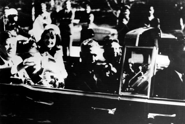 <p>President John F Kennedy and first lady Jacqueline Kennedy in an open car motorcade shortly before the president was assassinated in Dallas, Texas</p>
