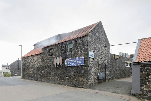 The 167-year-old smokehouse in Craster, Northumberland, has been given Grade II listed status (Historic England/PA)