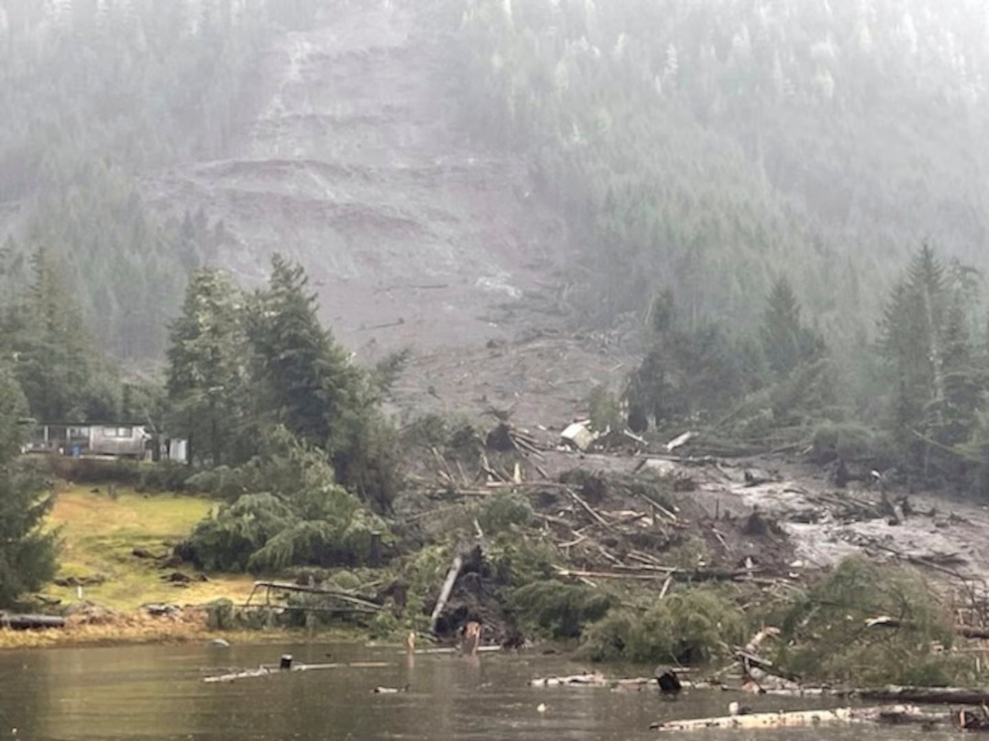 In this image provided by the US Coast Guard is the aftermath of a landslide in Wrangell, Alaska on Tuesday, 21 November 2023