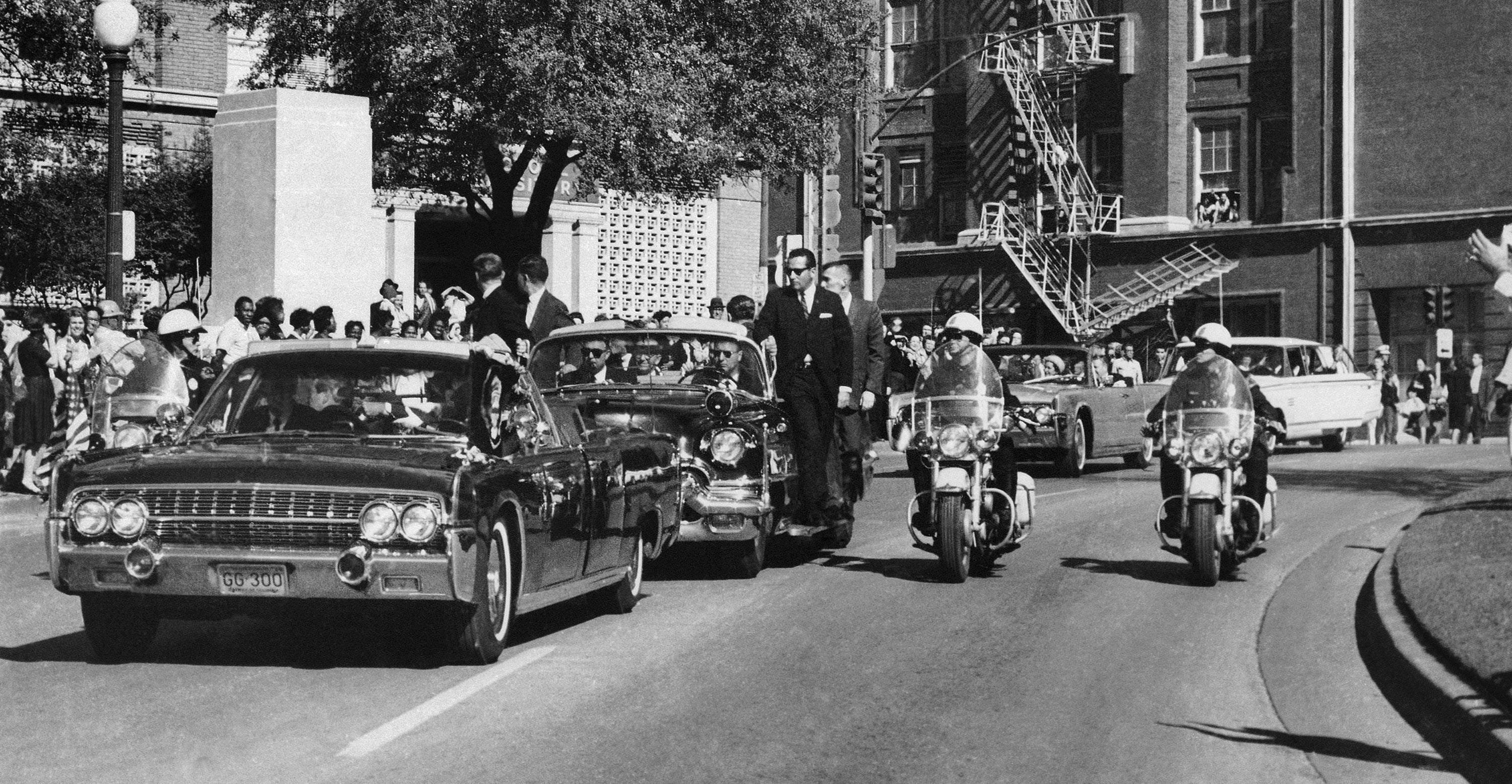 President John F Kennedy’s motorcade pictured in 1963, just moments before his assassination. Wecht found fame arguing Kennedy was assassinated by more than one person