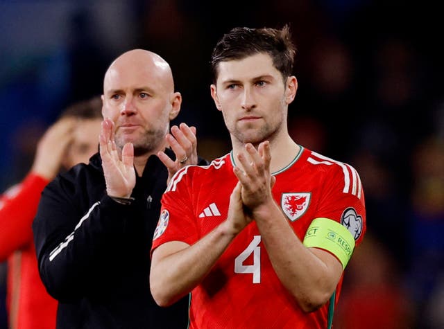 <p>Manager Rob Page with stand-in captain Ben Davies at full-time in the Euro qualifier against Turkey</p>