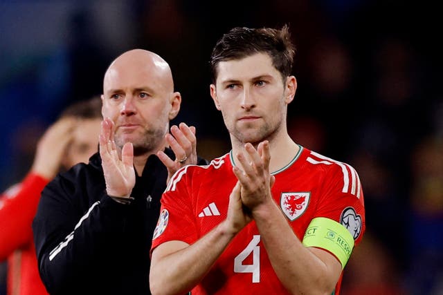 <p>Manager Rob Page with stand-in captain Ben Davies at full-time in the Euro qualifier against Turkey</p>