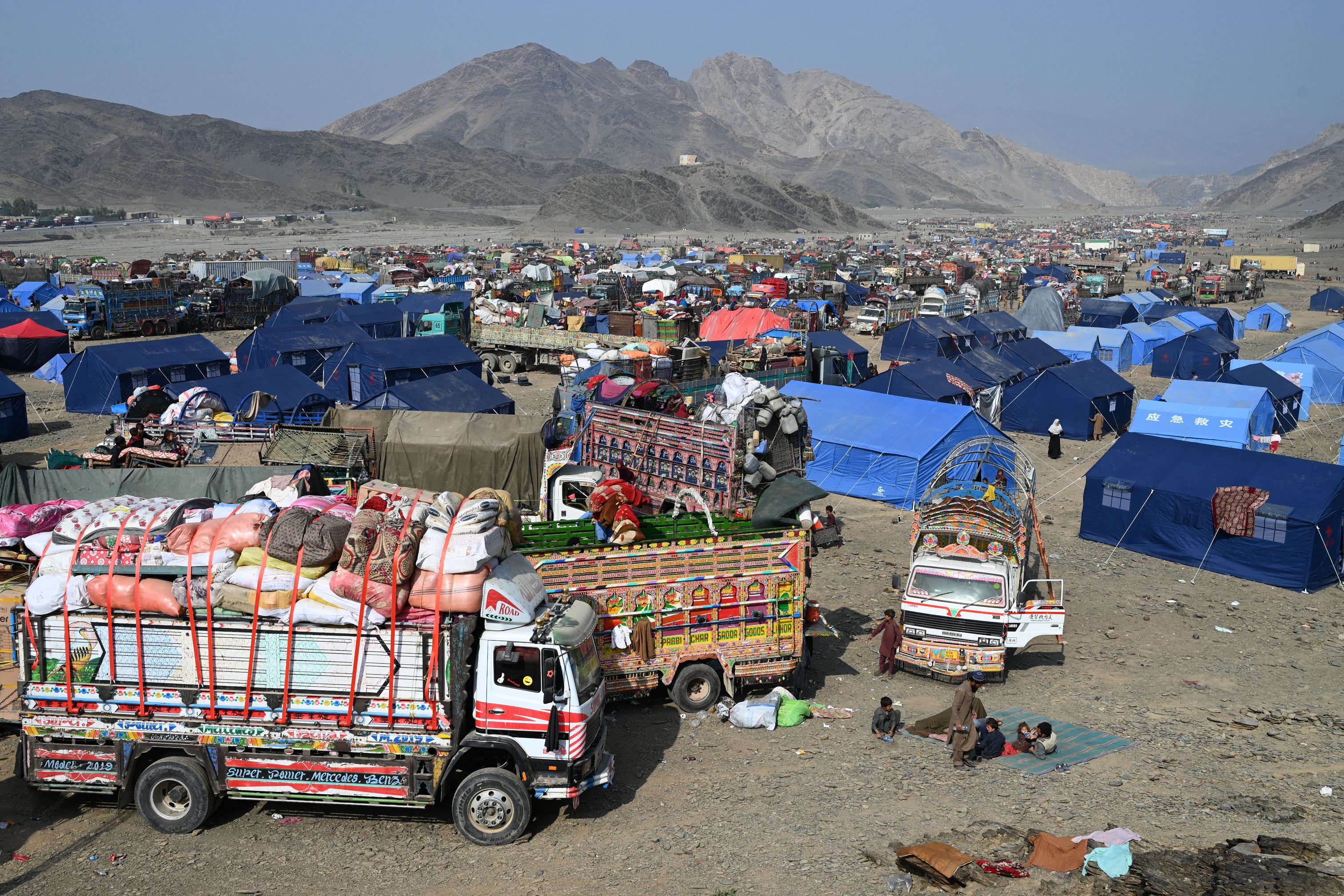 Afghan refugees who arrived from Pakistan at a makeshift camp near the Afghanistan-Pakistan Torkham border