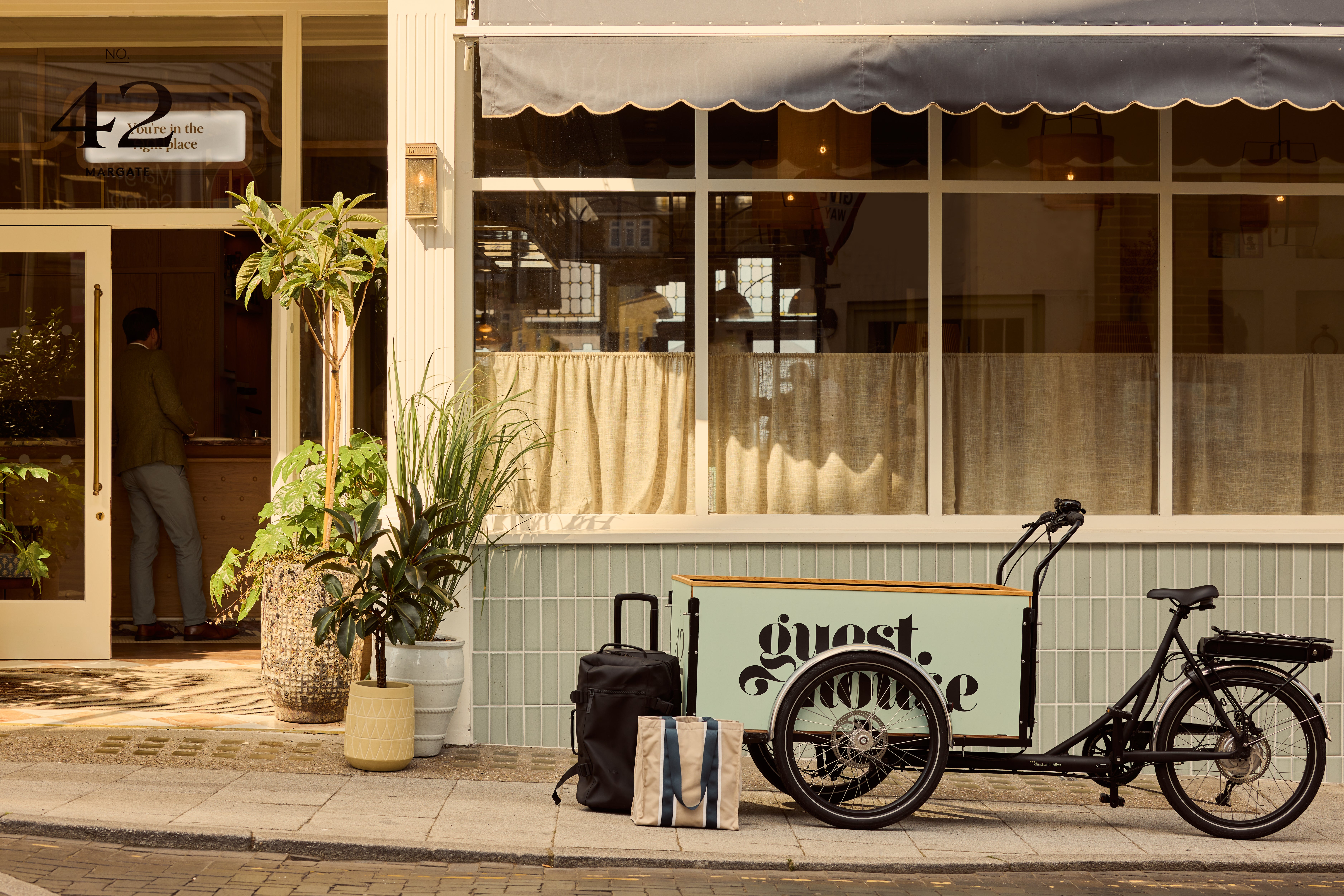 The high street hotel is designed in creamy tones with fern wooden floors and herringbone terracotta tiles