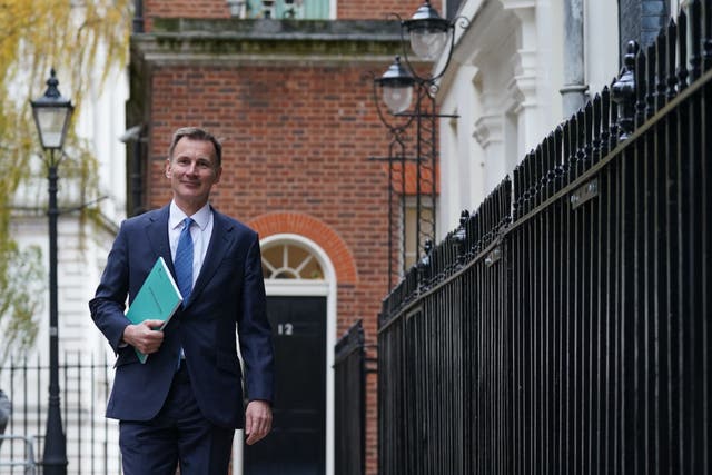 Chancellor of the Exchequer Jeremy Hunt leaves 11 Downing Street, London, for the House of Commons to deliver his autumn statement (Stefan Rousseau/PA)