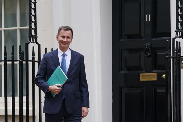 <p>Chancellor of the Exchequer Jeremy Hunt leaves 11 Downing Street, London, for Commons to deliver his autumn statement (Yui Mok/PA)</p>