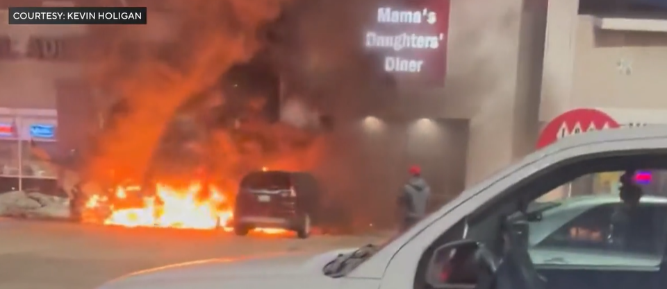 The plane caught fire as it crashed into the parking lot