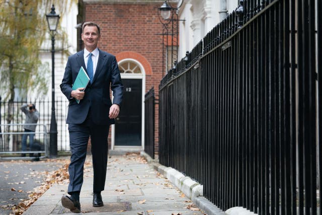 Chancellor of the Exchequer Jeremy Hunt has announced increases to the minimum wage, pensions and benefits (Stefan Rousseau/PA)