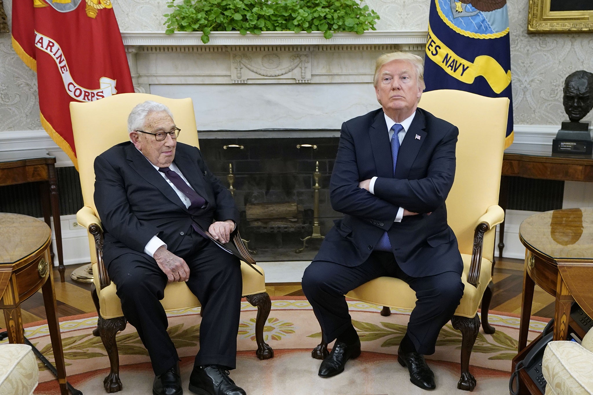 US President Donald Trump (R) meets with former US Secretary of State Henry Kissinger in the Oval Office of the White House on 10 October 2017 in Washington, DC.