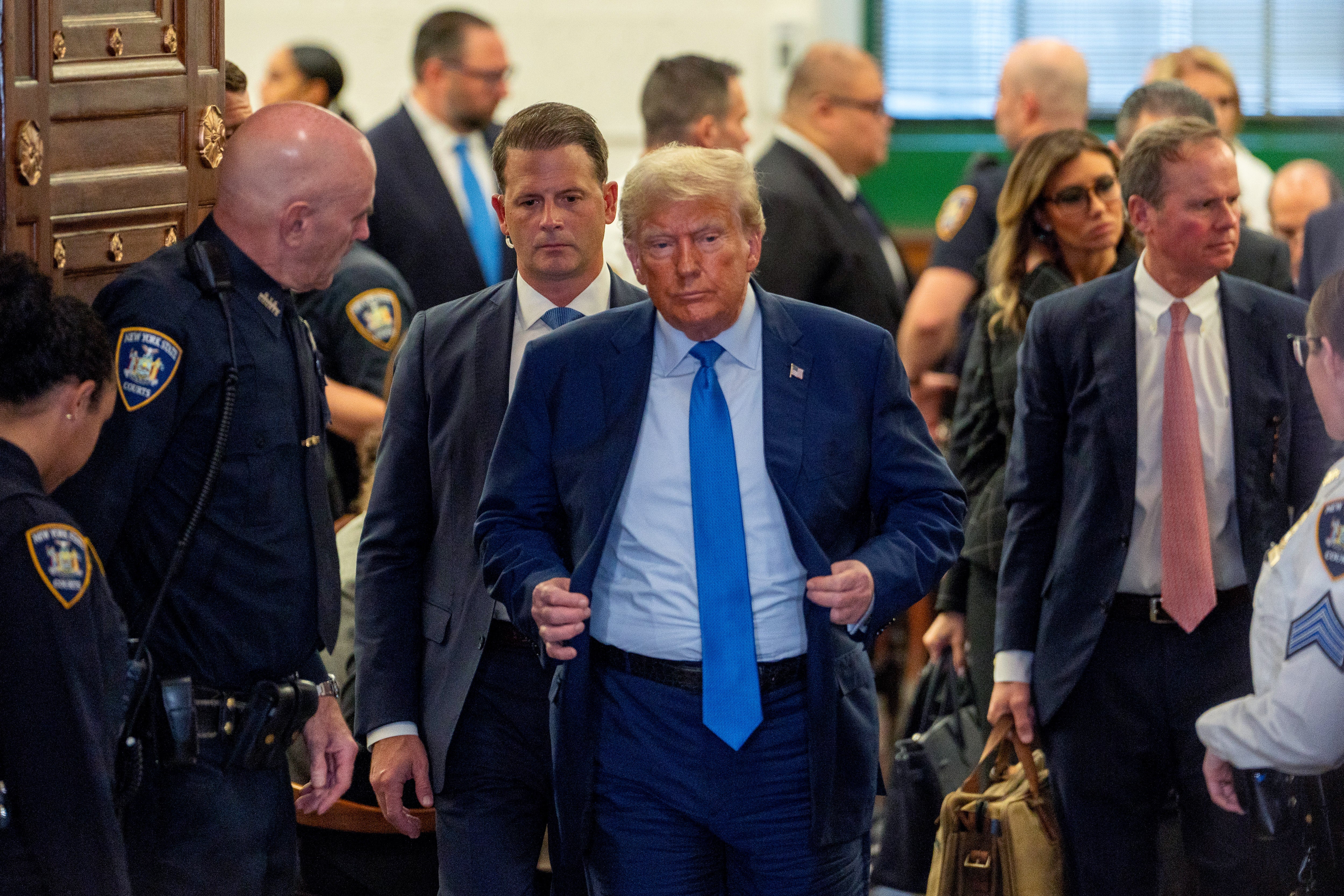 Donald Trump leaves Judge Arthur Engoron’s courtroom on 6 November after testifiting in a civil fraud trial targeting his real estate business