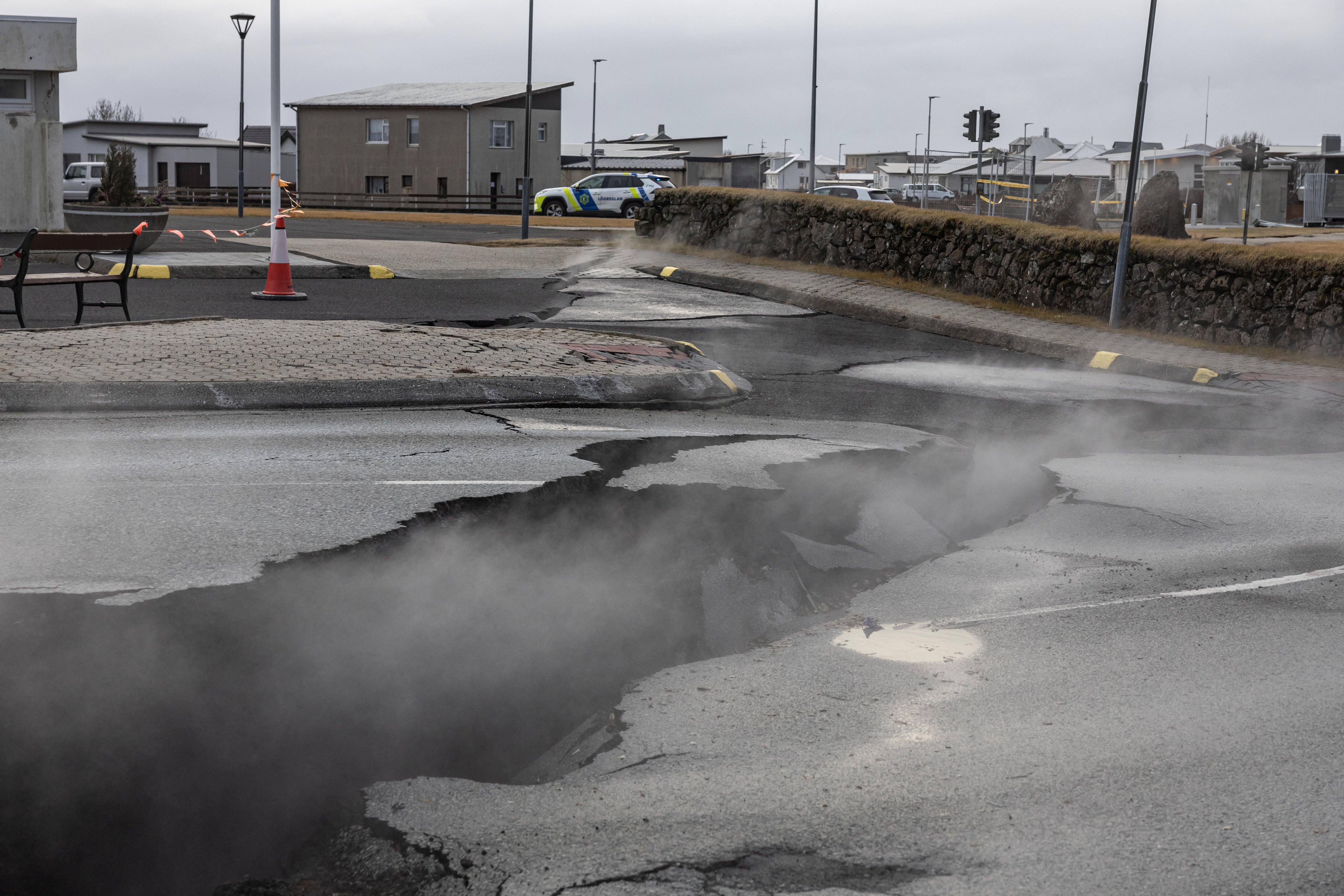 Smoke is seen rising from holes, in which residents say cats are hiding because it's warm'