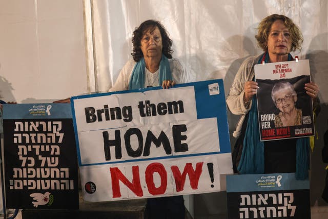 <p>Relatives and friends of Ditza Heiman in Tel Aviv call for her release</p>