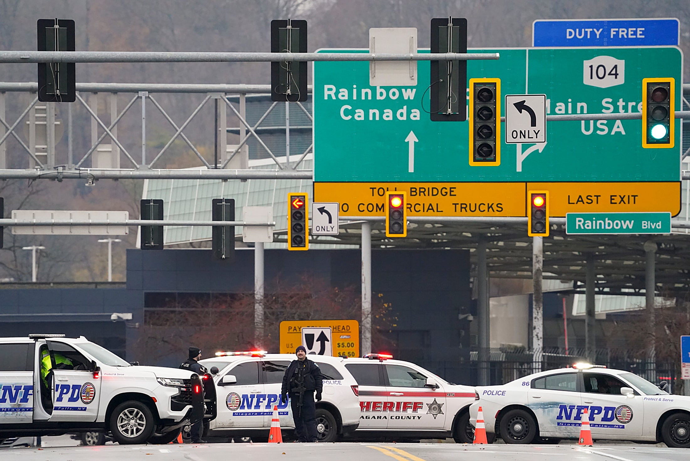 Law enforcement personnel block off the entrance to the Rainbow Bridge, Wednesday, Nov. 22, 2023, in Niagara Falls, N.Y.