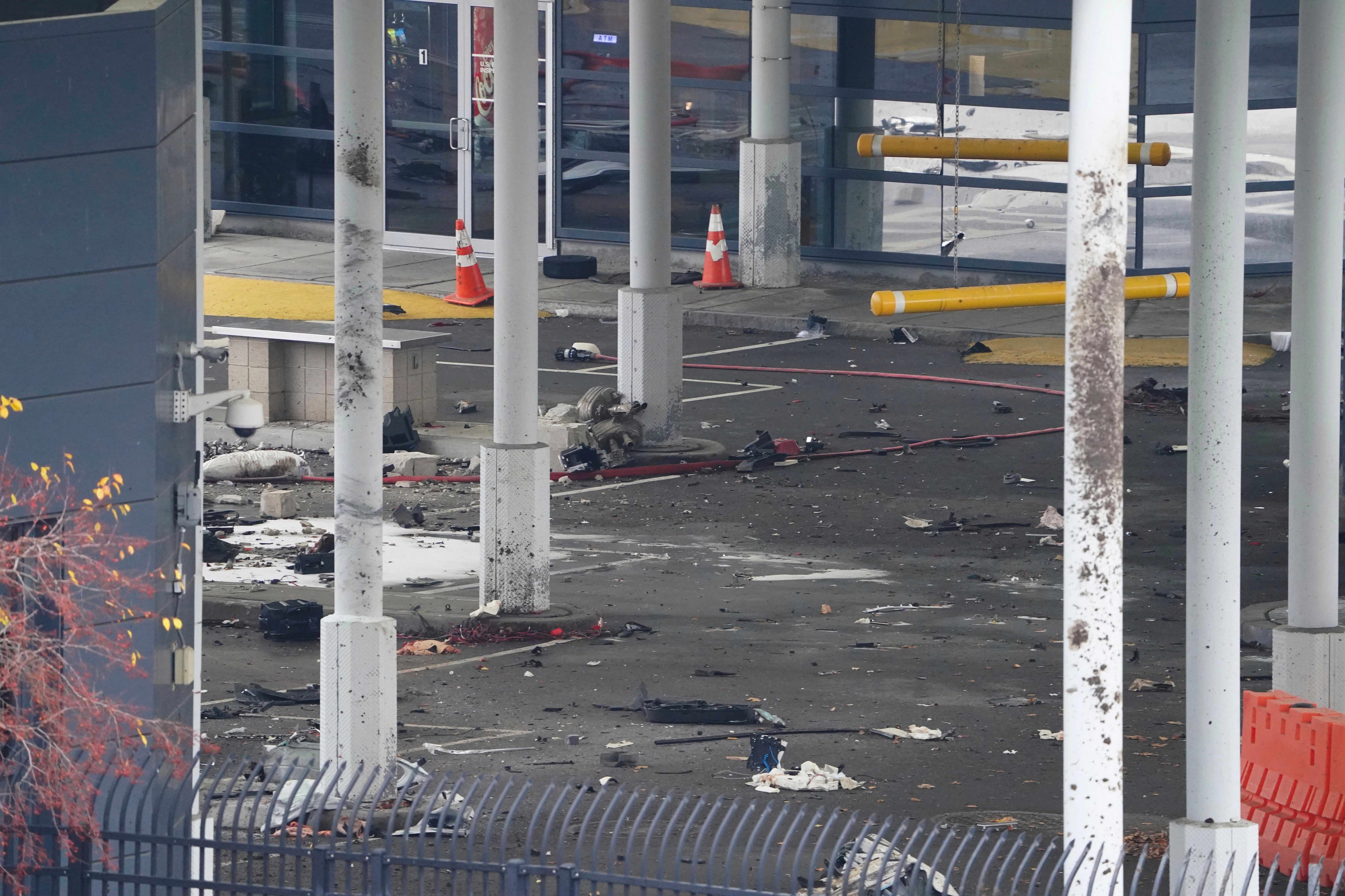 Debris is scattered about inside the customs plaza at the Rainbow Bridge border crossing